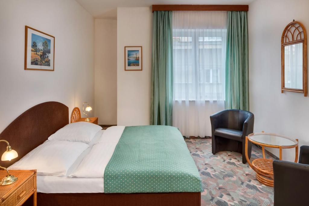 Postel nebo postele na pokoji v ubytování Hotel Otar