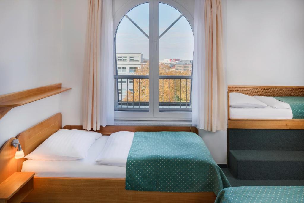 Postel nebo postele na pokoji v ubytování Hotel Otar