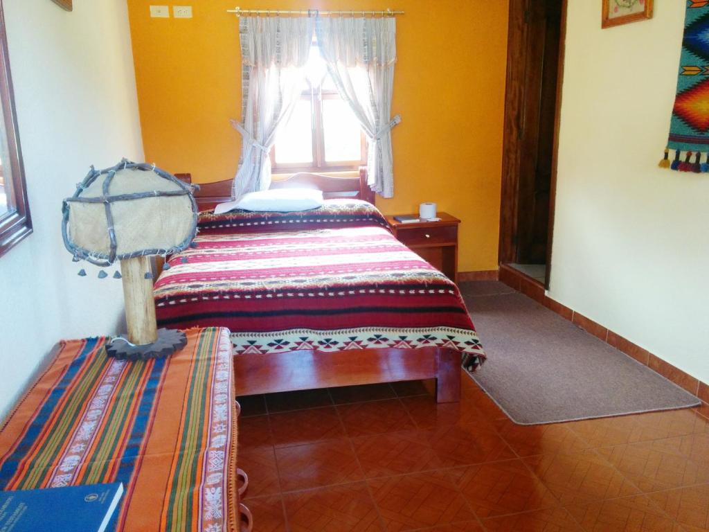 Postel nebo postele na pokoji v ubytování Hostal Curiñan