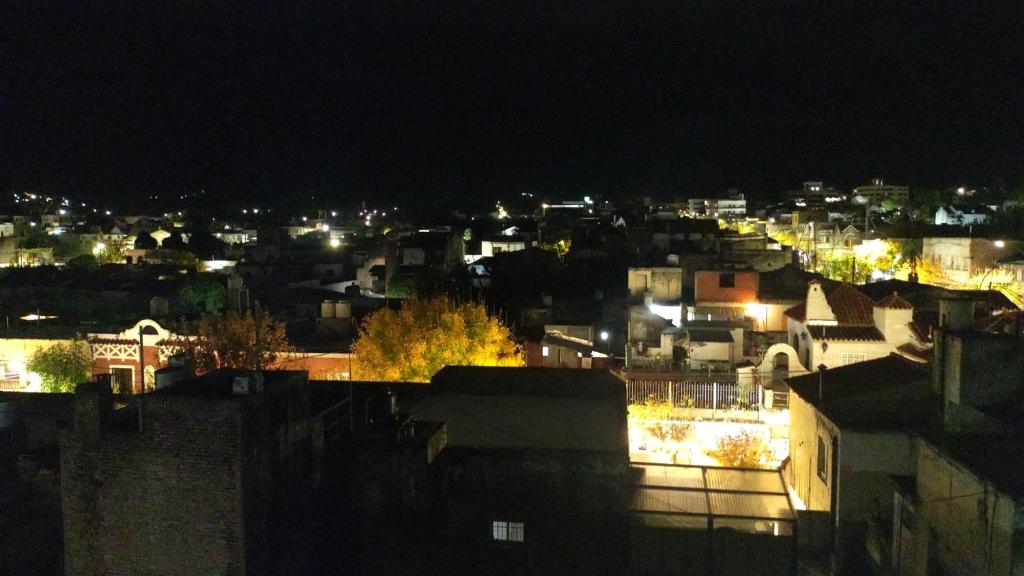 a view of a city at night at Edén in La Falda