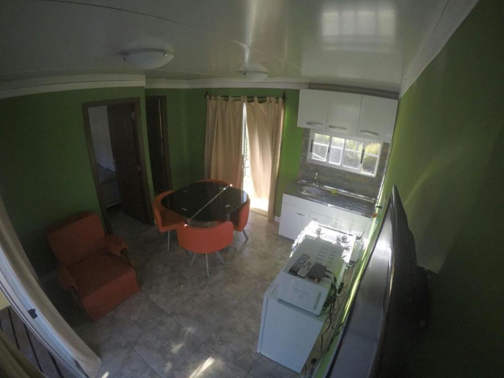 an overhead view of a kitchen and a living room at Apartamentos Titilandia in Piriápolis