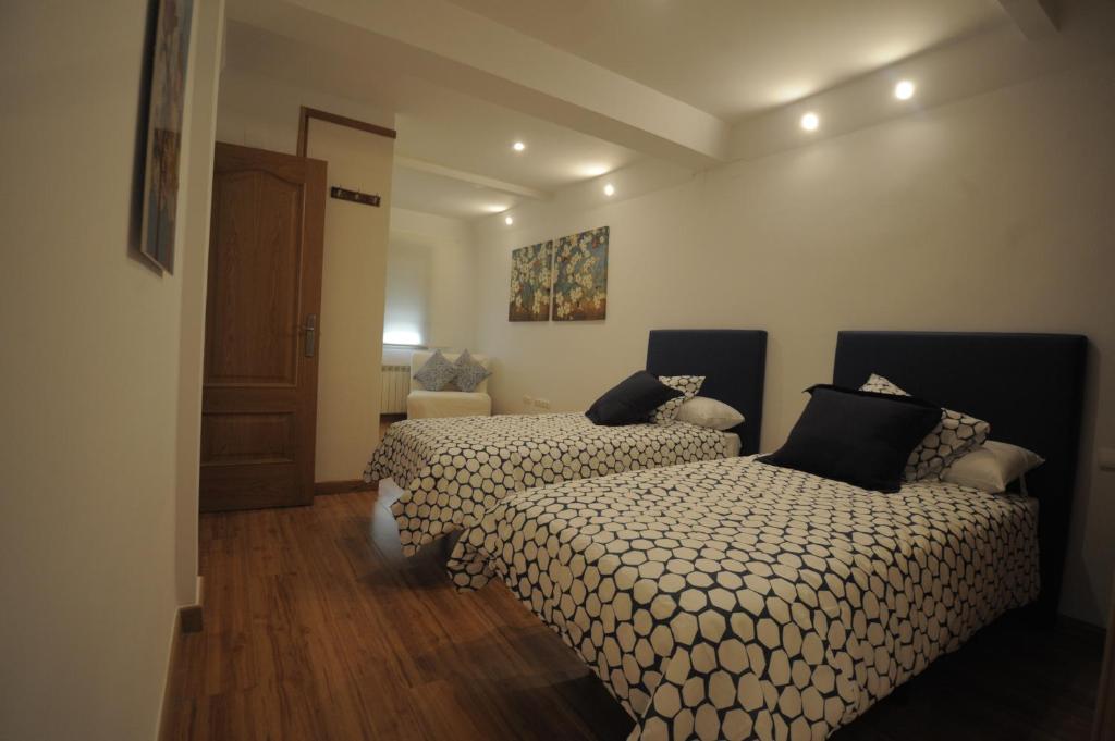 A bed or beds in a room at Cuencaloft La casa de Los Moralejos