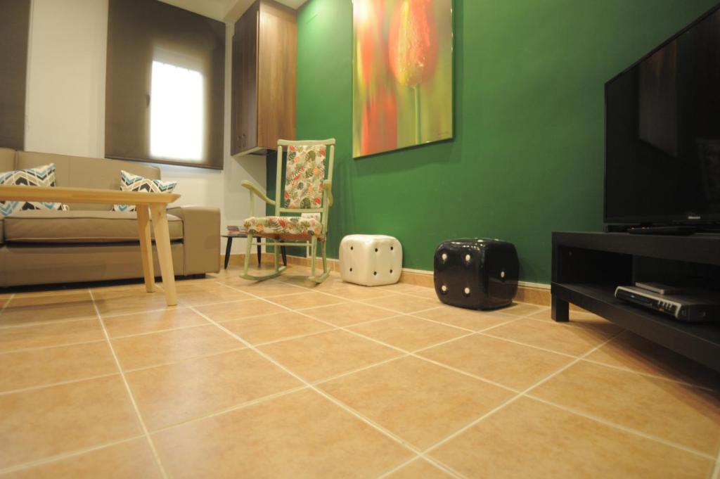 A television and/or entertainment centre at Cuencaloft La casa de Los Moralejos