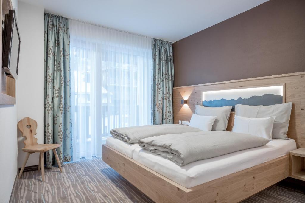 Postel nebo postele na pokoji v ubytování Hotel Mathiesn