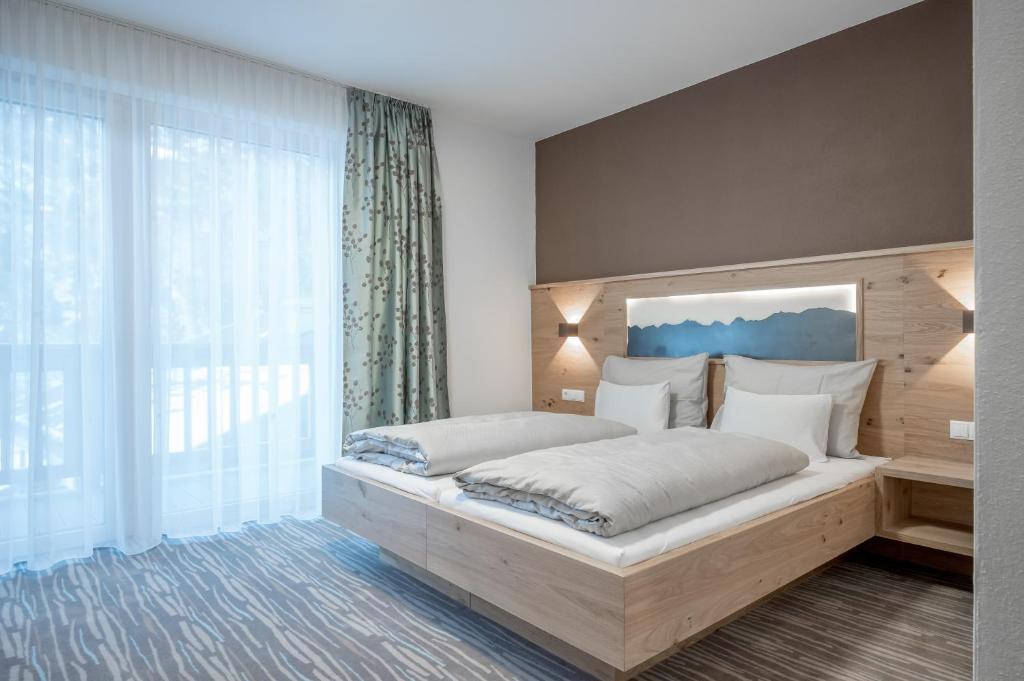 Postel nebo postele na pokoji v ubytování Hotel Mathiesn