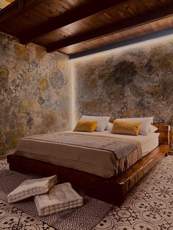 a bedroom with a large bed in a room at Antica e luminosa masseria in Lequile