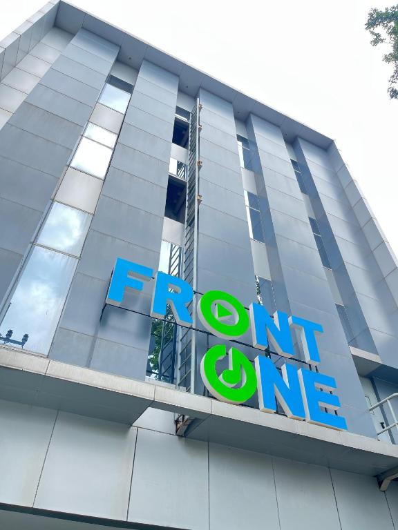 a sign on the front of a building at Front One Hotel Gresik in Panggang