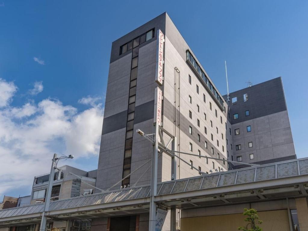 a tall building with a bridge in front of it at Gifu Washington Hotel Plaza in Gifu