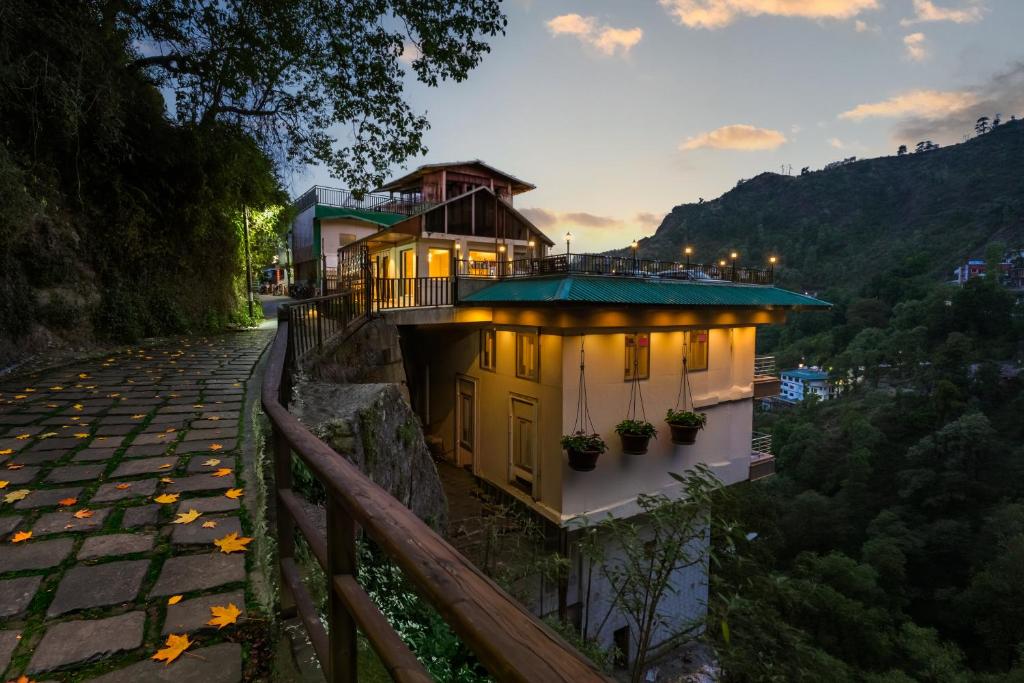 a building with lights on the side of a street at Tripli Hotels Royal Spring in Mussoorie