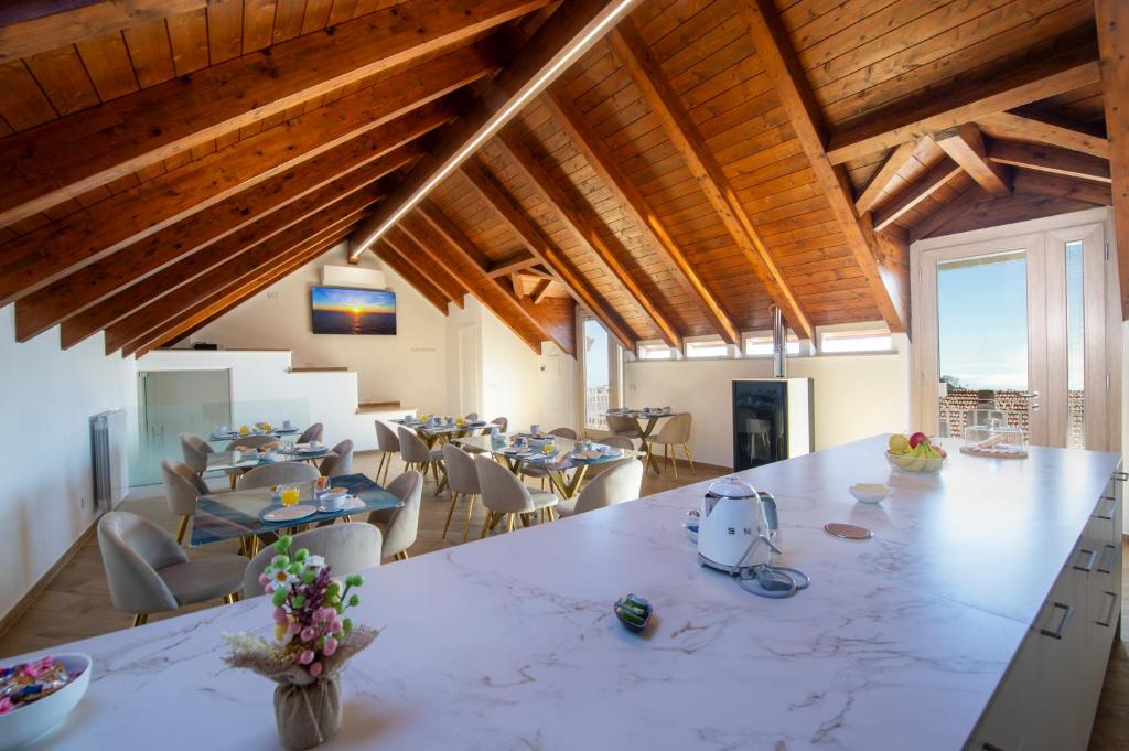 a large dining room with a large table and chairs at L'Incanto dei Monti in Agerola