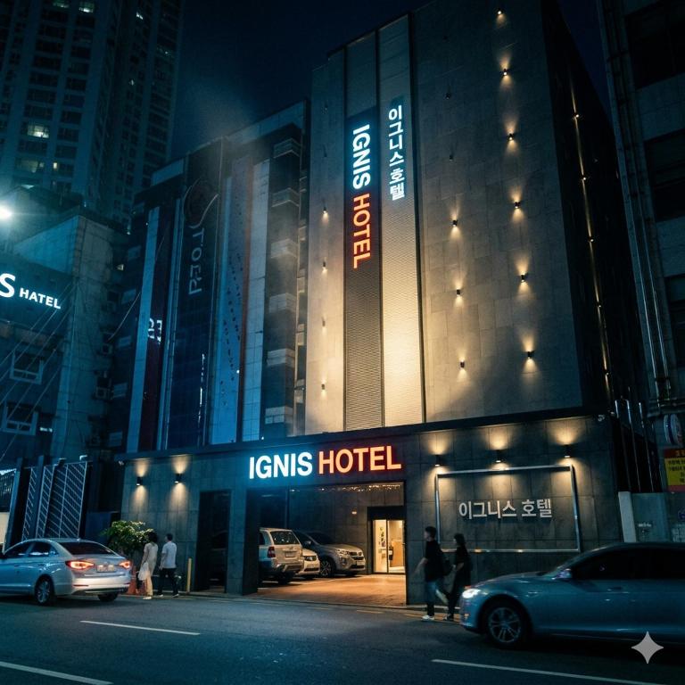 a building with a sign that reads lynns hotel at night at Ignis Hotel busan sports complex branch in Busan