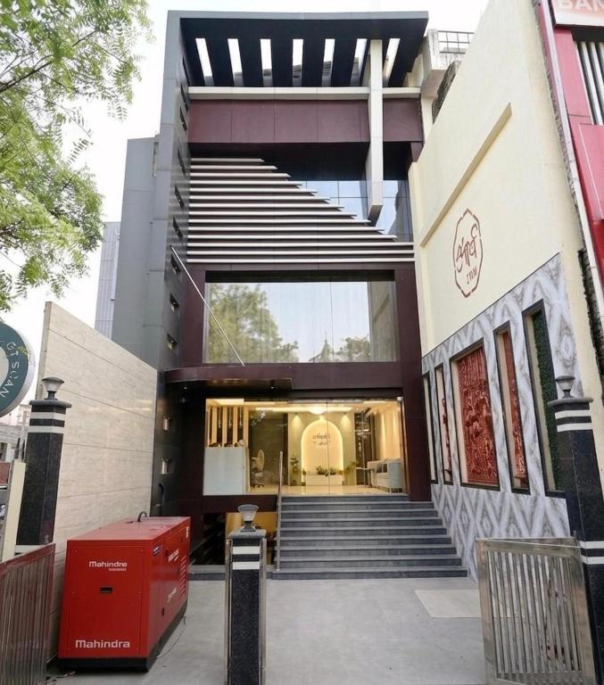 a building with a staircase in front of it at hotel arya inn in Prayagraj