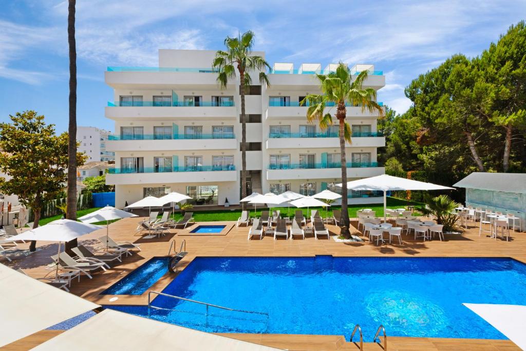 a hotel with a swimming pool and a resort at Metropolitan Juka Playa in Playa de Palma