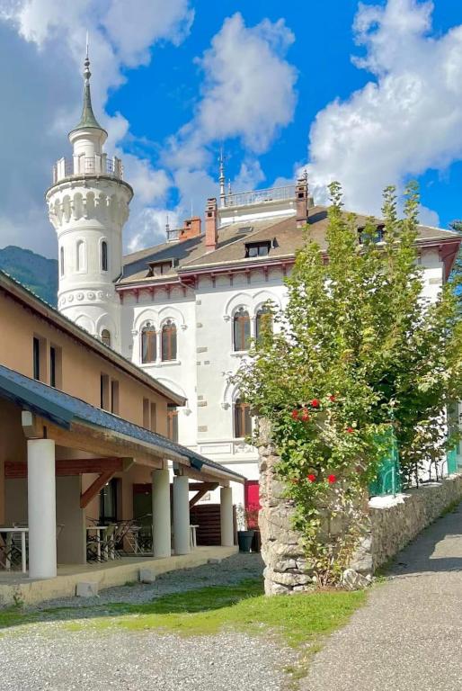a building with a lighthouse on top of it at Duplex equipped for 6 people in Jausiers