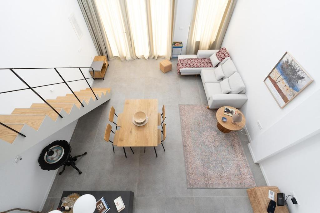 an overhead view of a living room with a couch and a table at Lixouri Square Loft in Lixouri