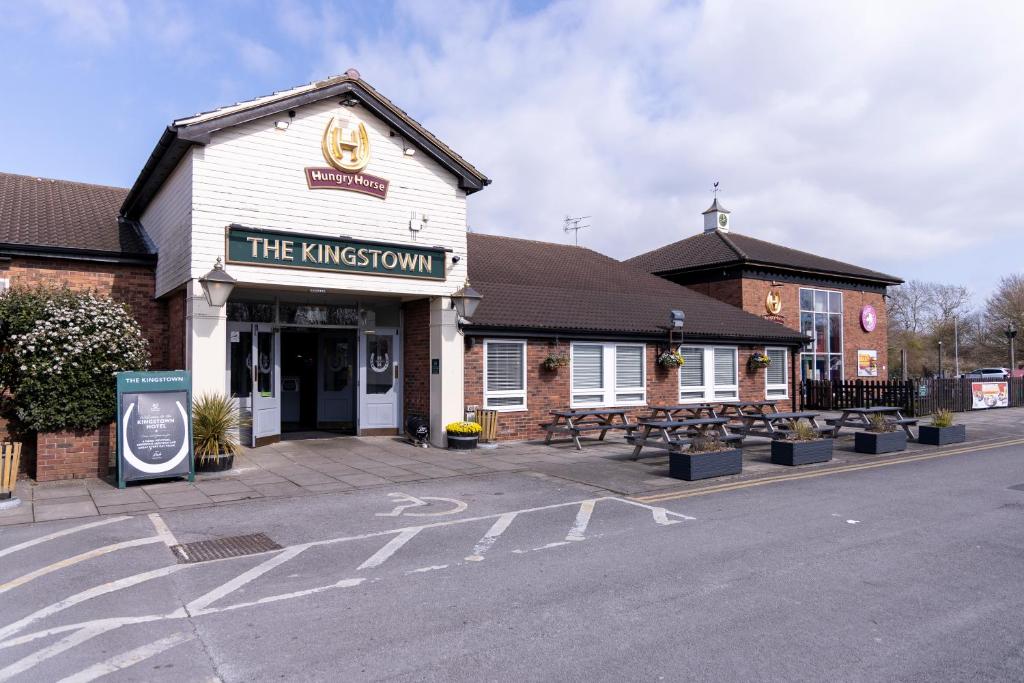 a building with a sign on the front of it at Kingstown Hotel by Greene King Inns in Hull