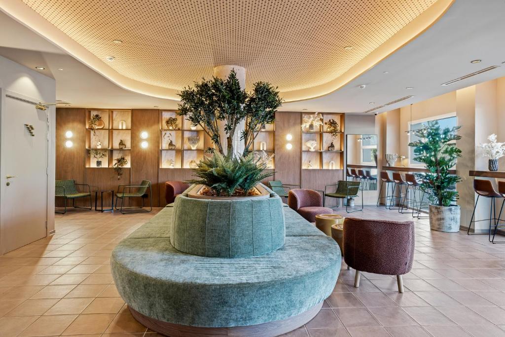 a lobby with a large fountain in the middle at B&B HOTEL Cieza in Cieza