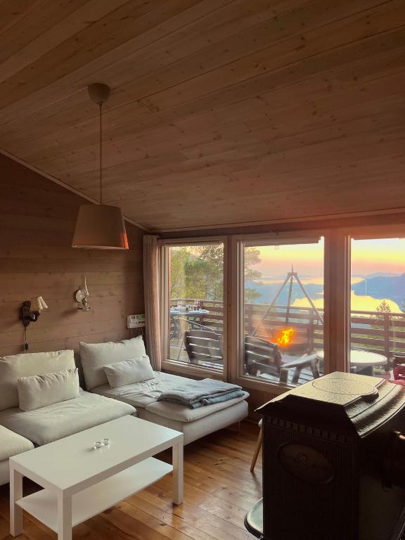 a living room with a couch and a table at Panoramic View - near Pulpit Rock in Strand