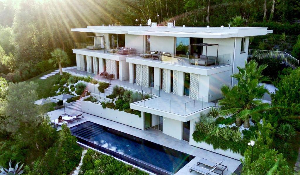 an aerial view of a house with a swimming pool at Villa Acquariva Private Heated Pool in Salò