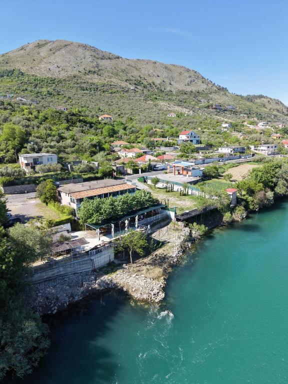 an aerial view of a river with a town at Ergi Riverside Villas in Zues
