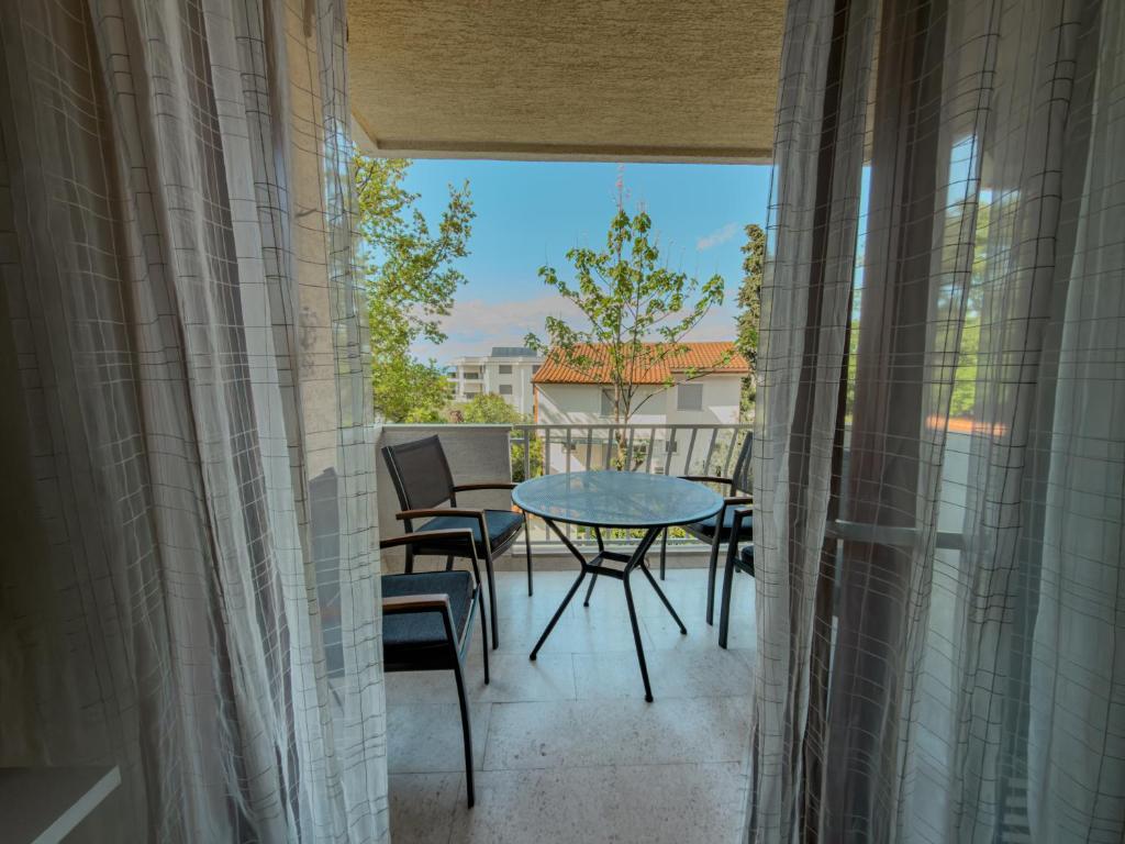 a view of a balcony with a table and chairs at Jellyfish in Malinska
