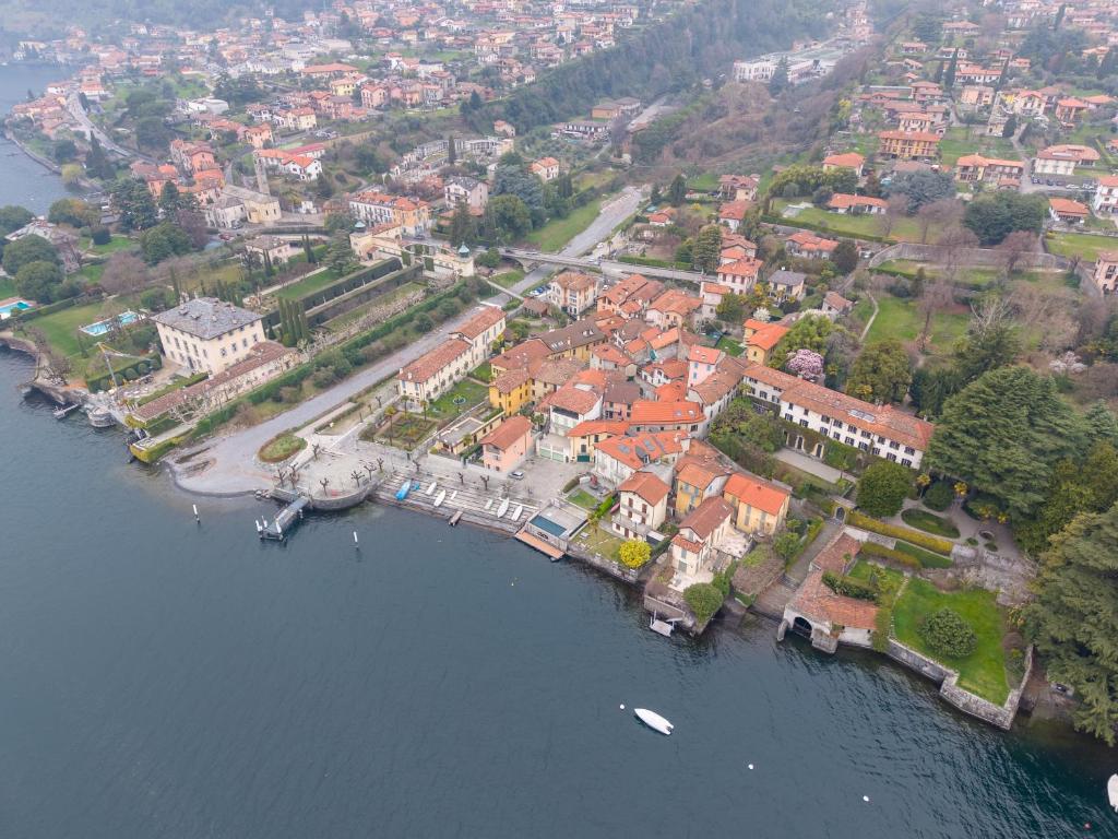 an aerial view of a town next to the water at Historic Borgo Lake Como Campidoglio 3 in Lenno