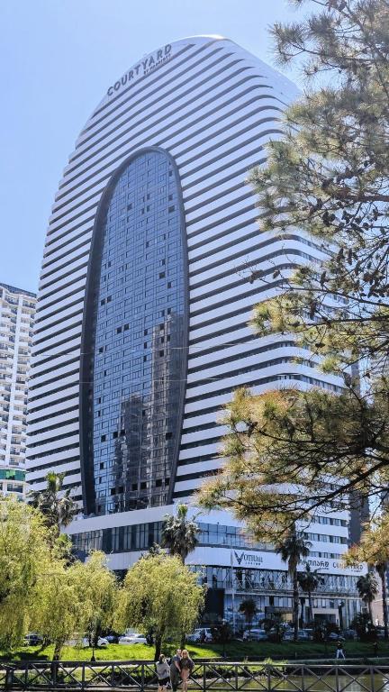 a large building with a lot of windows at VIP In Alliance Palace in Batumi