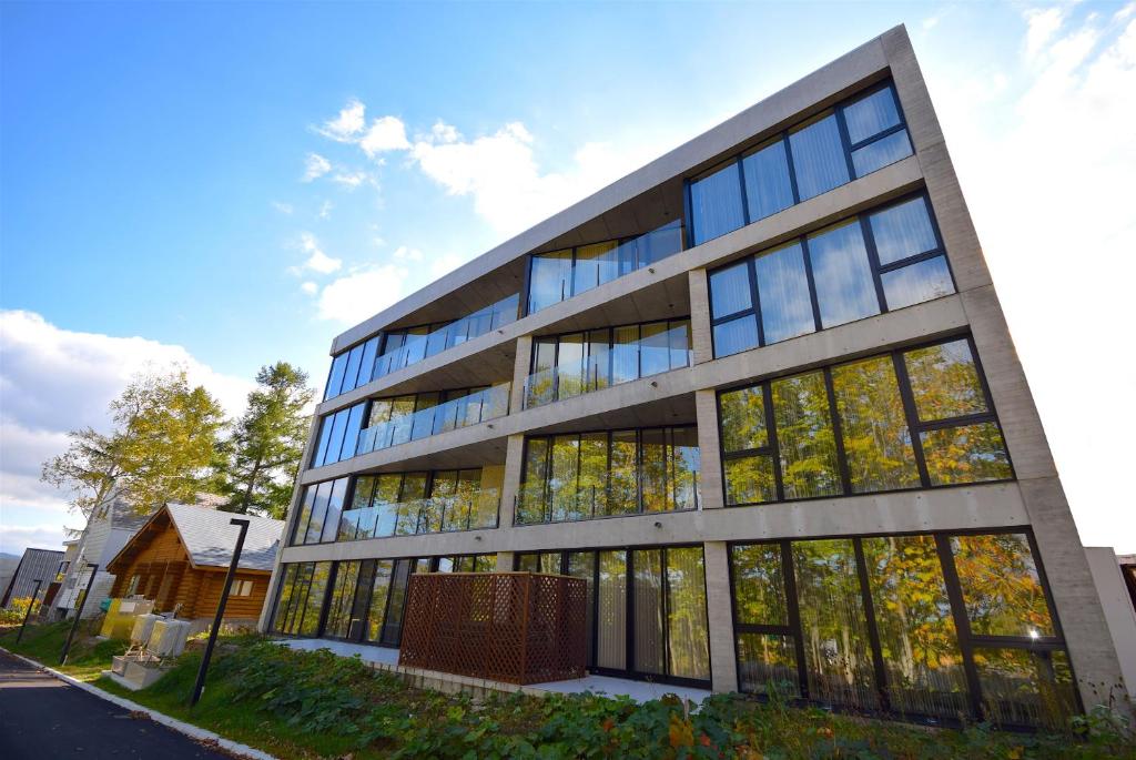 an office building with a lot of windows at Kozue in Kutchan