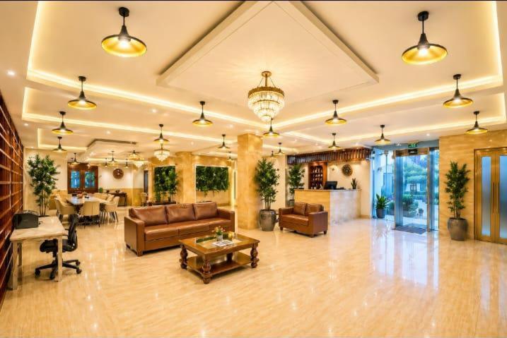 a large living room with a couch and a table at The Lohmod Premier Aerocity on NH-8 Mahipalpur Delhi Airport in New Delhi