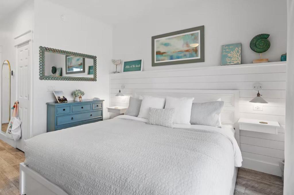 a white bedroom with a white bed and a blue dresser at Bluehavenon30a-Between Rosemary & Alys Beach -Steps to Beach & Dining-Sleeps 3 in Rosemary Beach