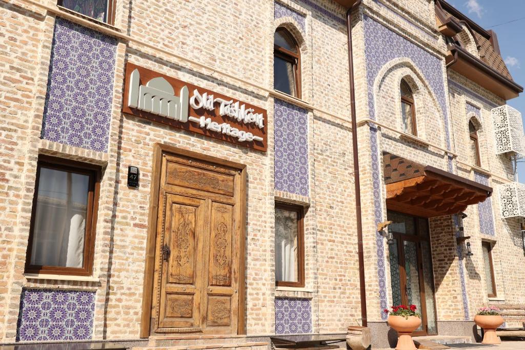 a building with blue and white tiles on it at Hotel Old Heritage in Tashkent