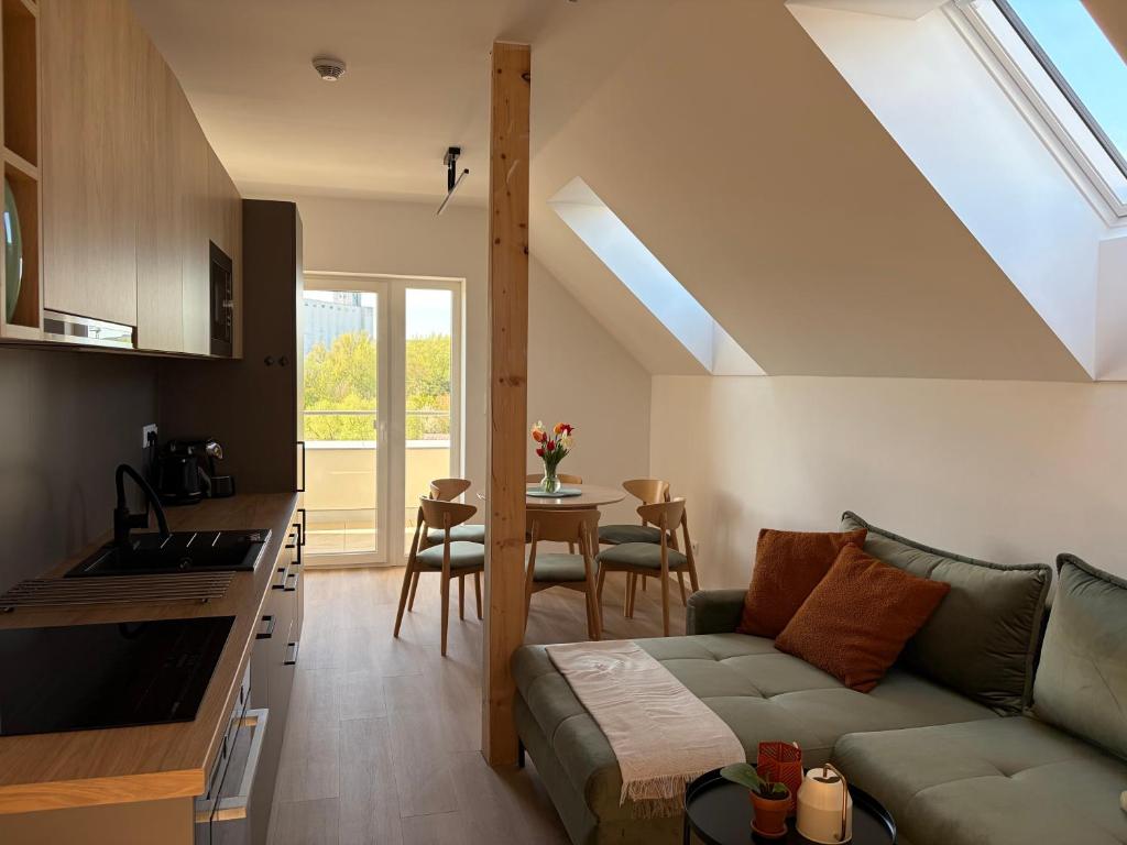 a living room with a couch and a table at Apartmány u Zvonice in Kyjov