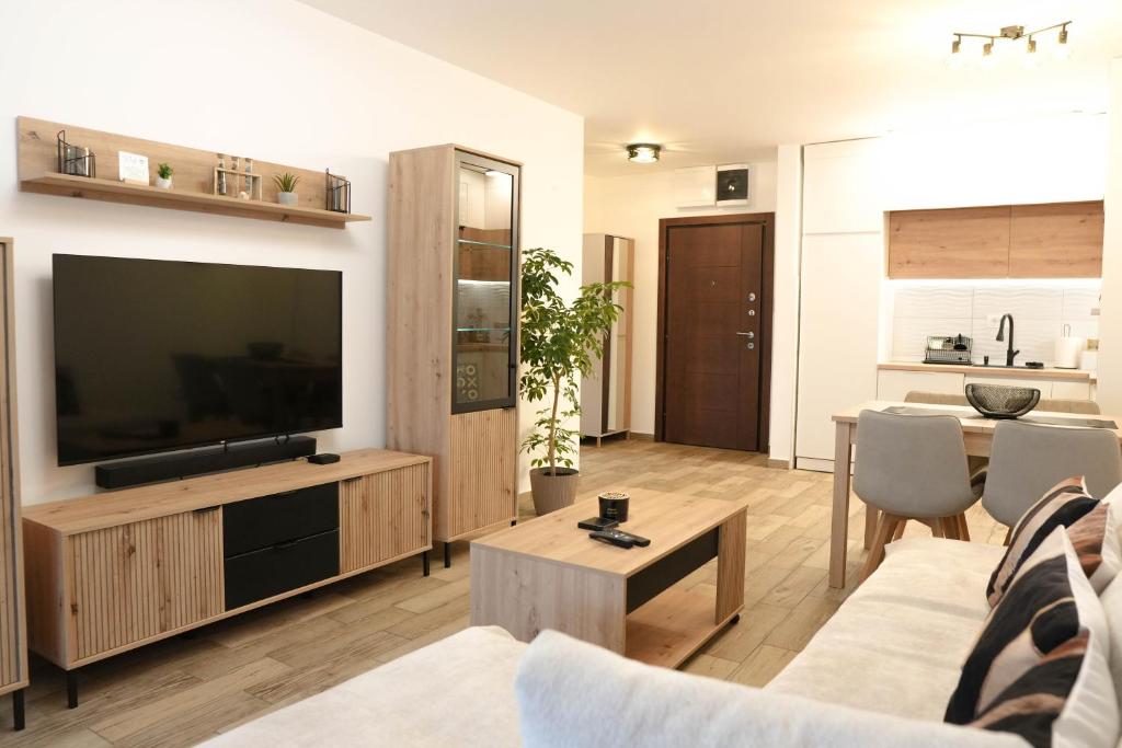 a living room with a large flat screen tv at StarLux Residence - Because you deserve it! in Ćuprija