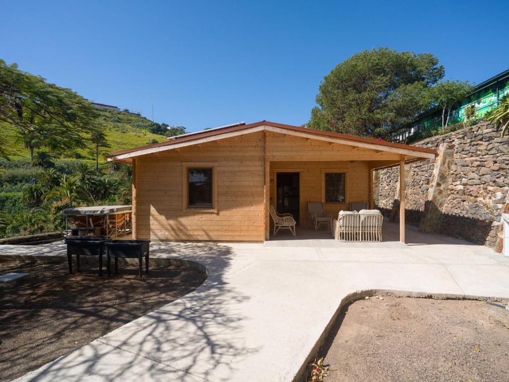 a small wooden house with a patio at Rustic Home By CanariasGetaway in Telde