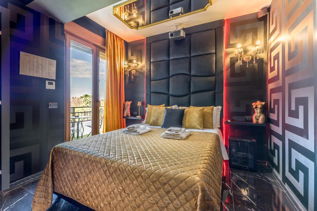 a bedroom with a large bed in a room at Int 37 Luxury Rooms in Rome