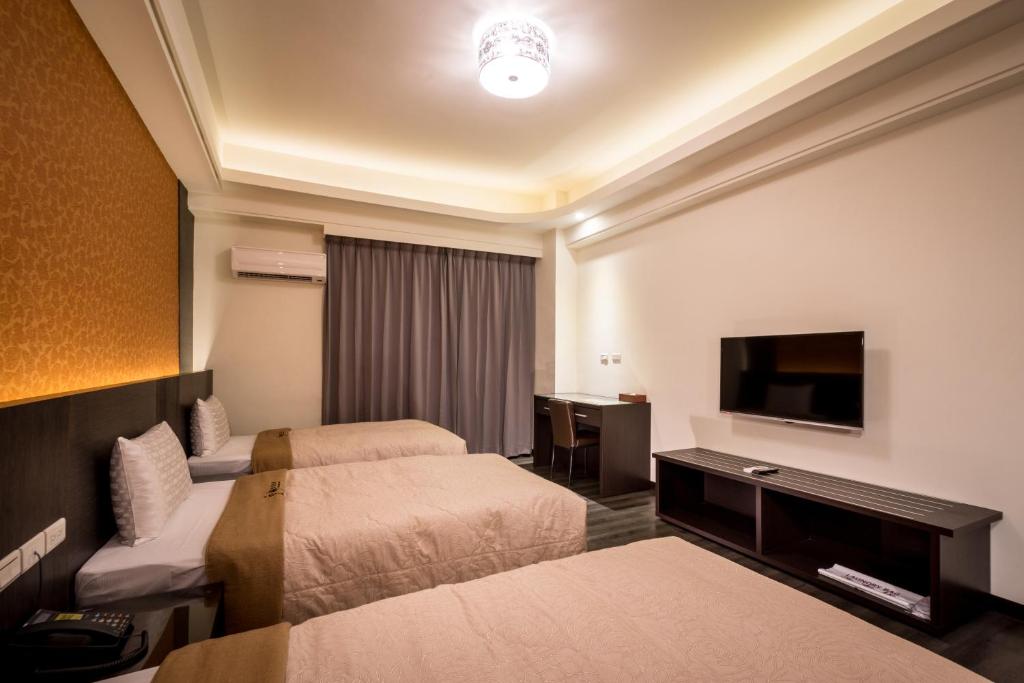 Postel nebo postele na pokoji v ubytování Yundu Business Hotel