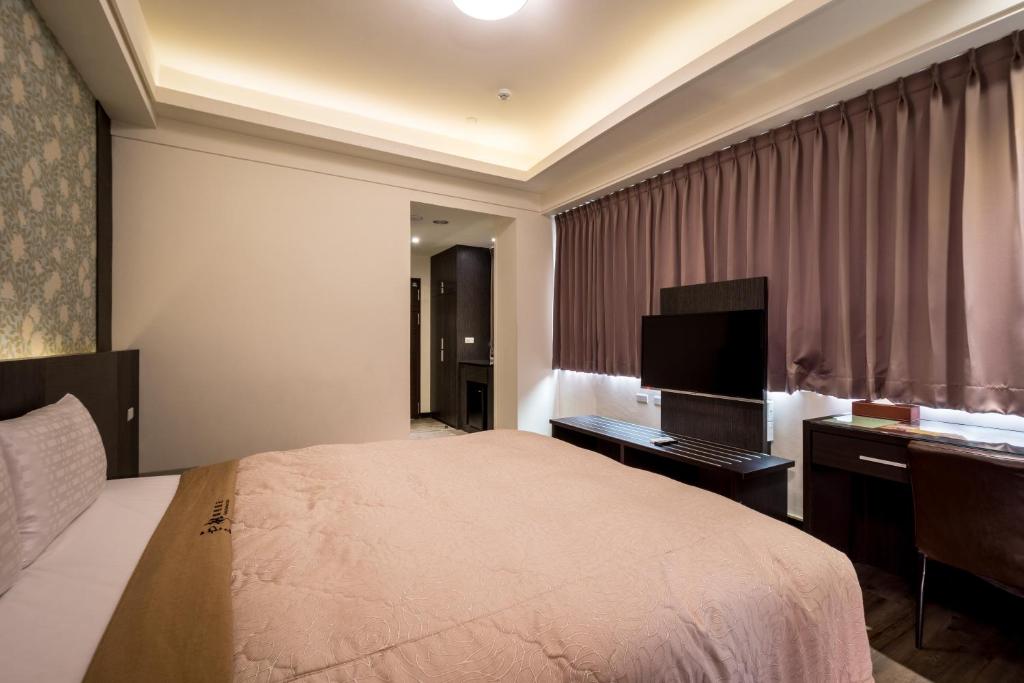 Postel nebo postele na pokoji v ubytování Yundu Business Hotel