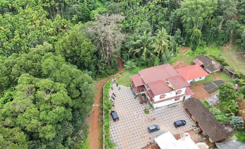 an aerial view of a house with a roof at Belandoor Nature Nest in Sringeri