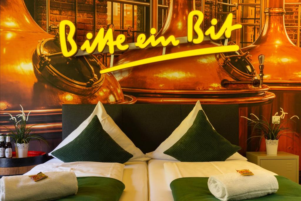 a bedroom with a bed with a sign that reads blue inn bite at Hotel Restaurant Litermont in Nalbach