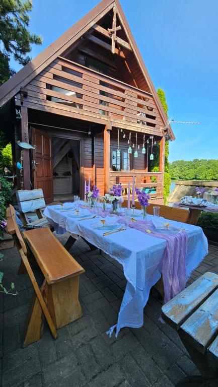 a large long table in front of a house at Wysockie Zacisze in Osowa