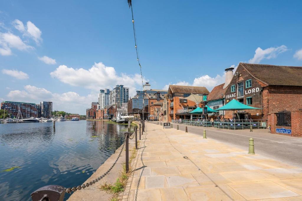 a city street with buildings and a river with buildings at The Merchant House, Ipswich in Ipswich