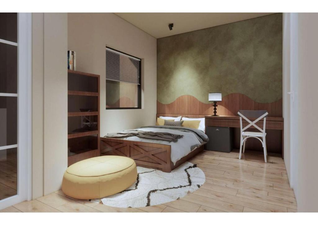 a bedroom with a bed and a desk and a stool at Mint Home in Danang
