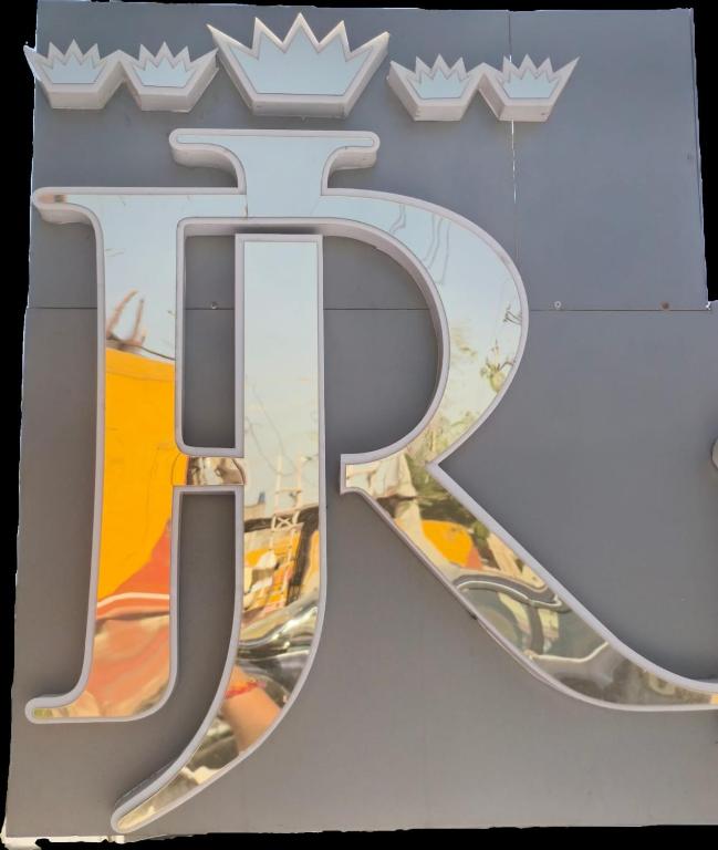 a sign with the number on a building at Hotel Jairaj in Alwar