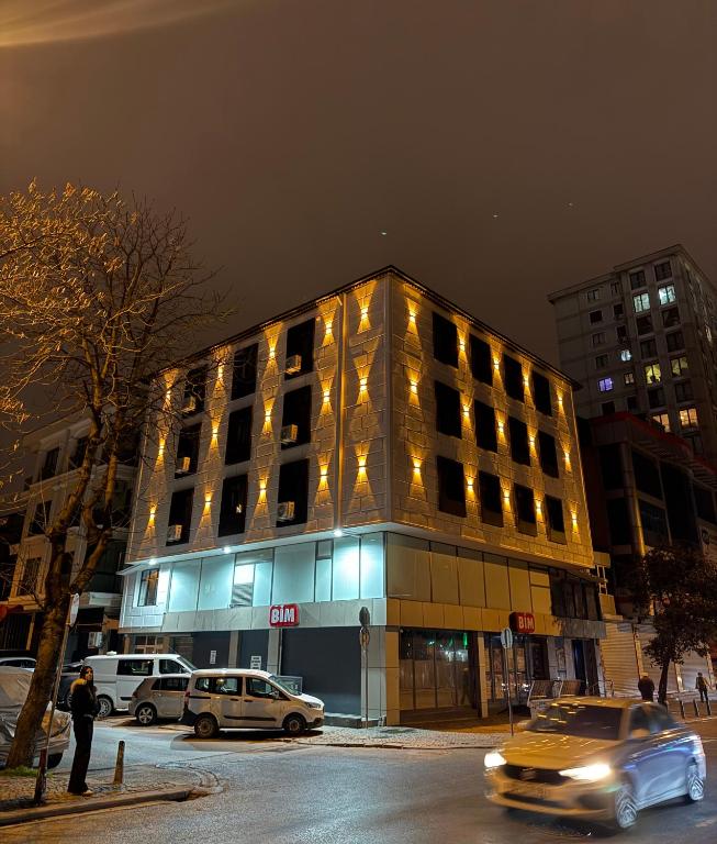 a building with cars parked in front of it at Twelve Diamond Hotel12 in Istanbul