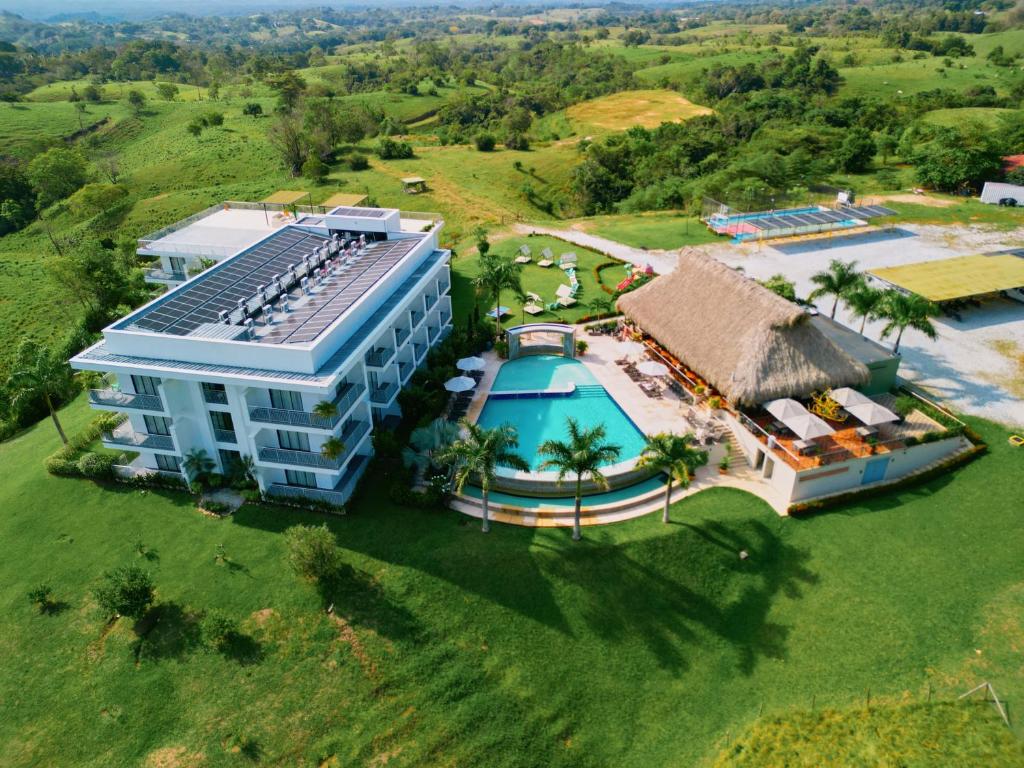 an overhead view of a building with a swimming pool at Hotel Arbóreo Doradal in Doradal