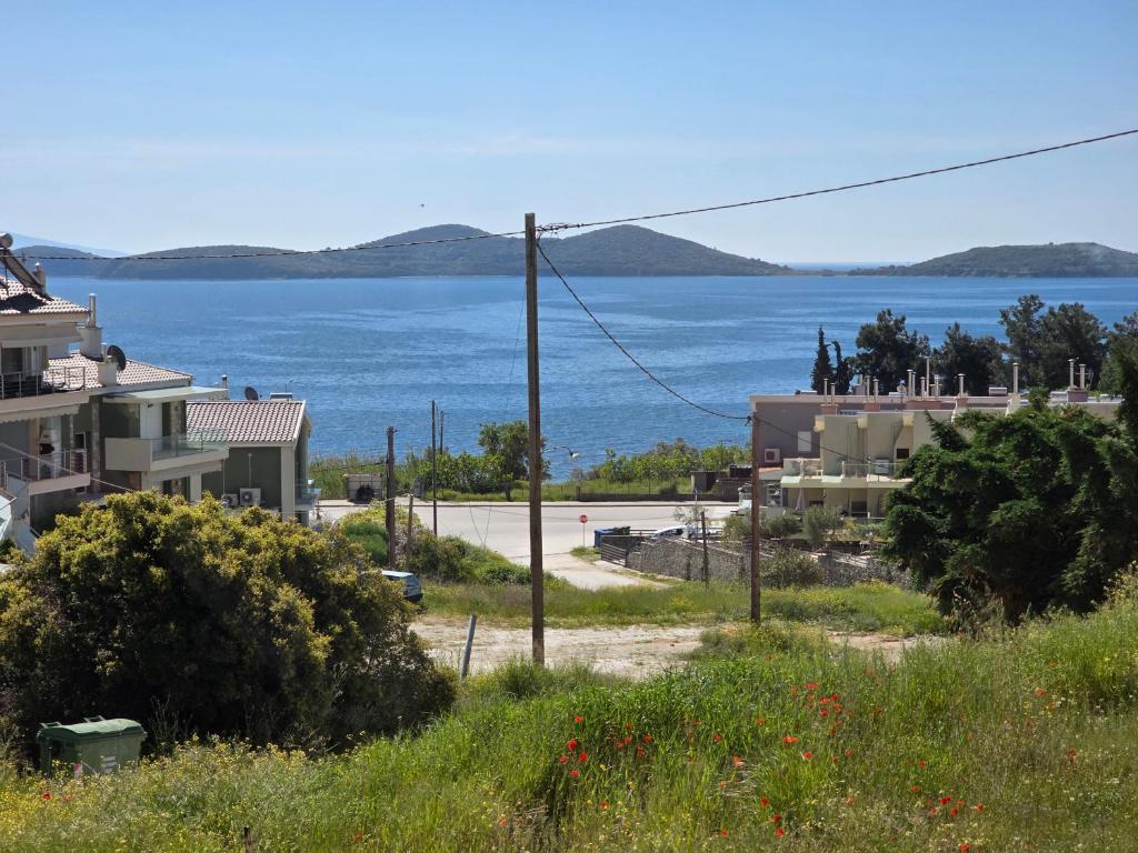 a view of a large body of water with buildings at Peramos Sea View in Nea Peramos