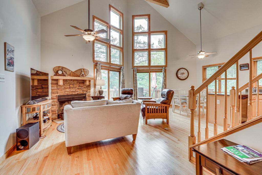 a living room with a couch and a fireplace at Shenandoah A-Frame Chalet at Bryce Resort in Basye