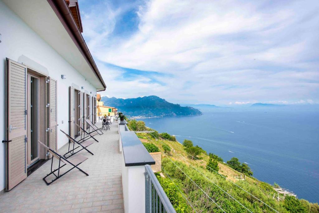 a balcony of a building with a view of the ocean at Coastal Escape, Amalfi in San Lazzaro Agerola