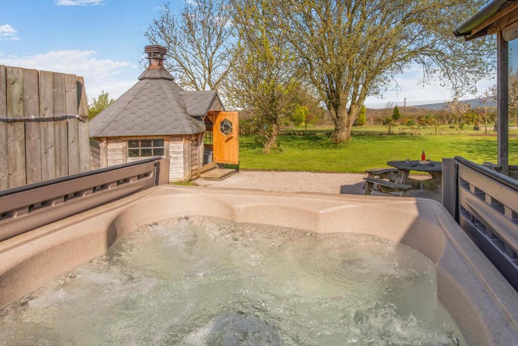 a hot tub in the middle of a backyard at 6 Bed in Blackburn oc-c38221 in Balderstone