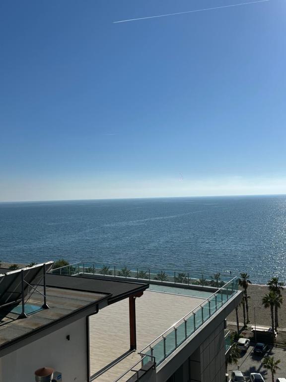 a view of the ocean from the balcony of a building at Sol & Sea Apartments 2 in Shëngjin